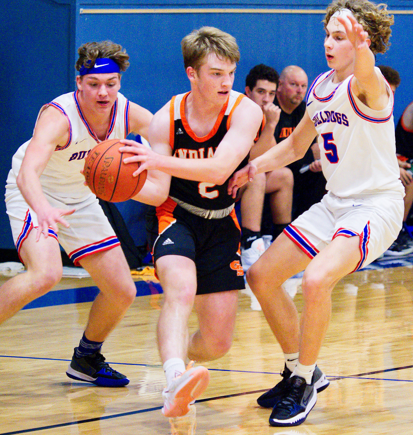 Garin Kisinger and Brady Floyd apply defensive pressure to the Grand Saline ball handler. [see more holiday hoops]